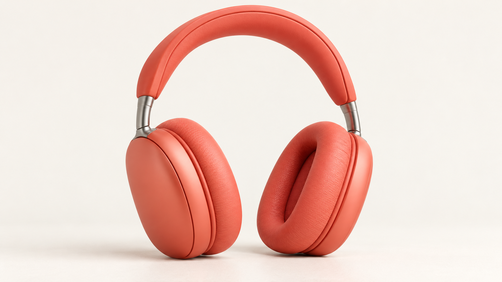 Auriculares circumaurales coral con conectores plateados.
